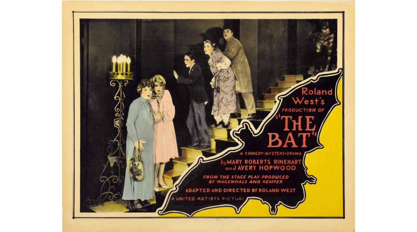 Color lobby card for The Bat (1926): four characters creep down a staircase beside a candelabrum, with a bat‑shaped title cartouche; Undercrank’s 2K restoration from UCLA elements with a new Ben Model score.